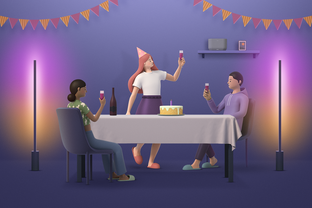 블루투스 스피커와 스마트 조명이 있는 공간에서 파티를 즐기는 3명의 남녀